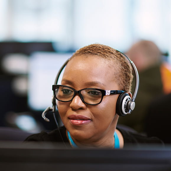 Bupa Global customer service advisor taking calls on headset