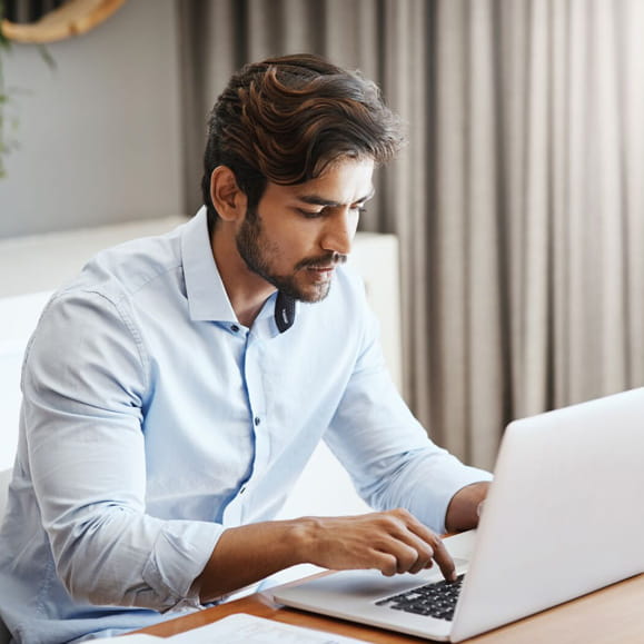 Person using laptop in home office