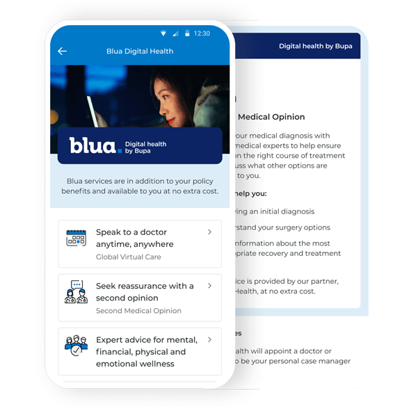 Woman looking at her tablet laying down on her bed in a dark room at night