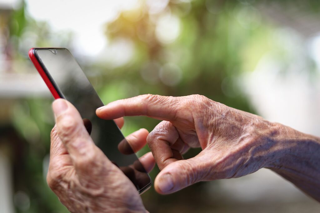 hands using a mobile phone