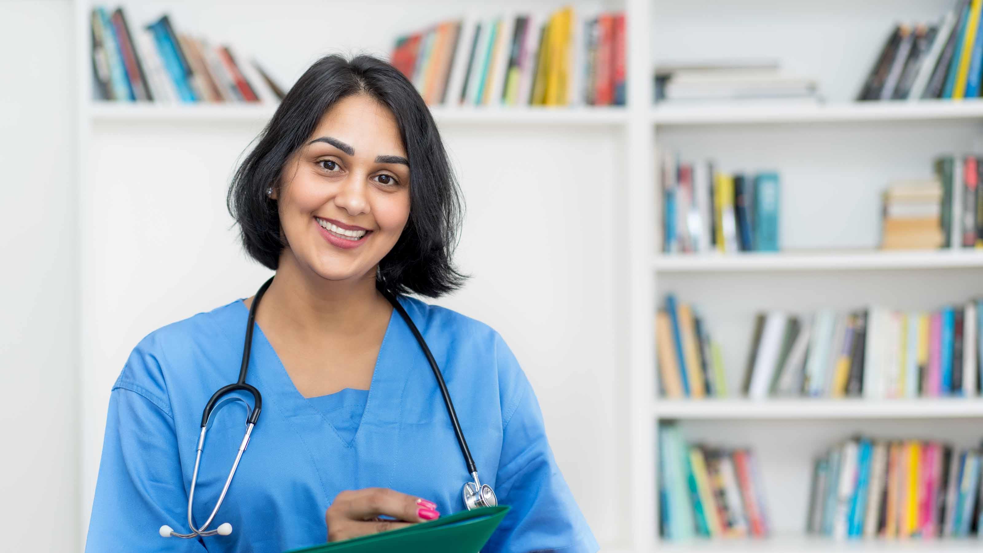 doctor holding clipboard with stethoscope